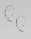 Delicate arcs of 14k gold are set with faceted beads of sterling silver and gold in these elongated, modern hoops with a subtle shimmer.14k yellow gold and sterling silverLength, about 1¼Ear wireMade in USA