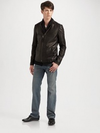 A unique, cardigan-style design crafted in washed lambskin leather; a scarf is attached to offer cozy comfort on even the coldest days. Partial zip front Attached scarf Side slash pockets About 27 from shoulder to hem Fully lined Dry clean Imported 