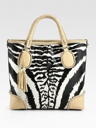 Lush zebra-print haircalf pairs with woven leather in this roomy carryall.Double top handles, 5 dropTop hook closureProtective metal feetOne inside zip pocketTwo inside open pocketsLinen lining13¼W X 12H X 5DMade in Italy