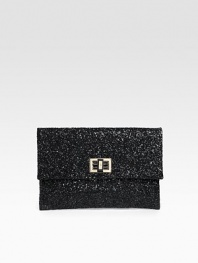 A cocktail essential covered in glittery fabric with a turnlock clasp and rich leather lining.Turnlock closure One inside open pocket Leather lining 9W X 6¼H X ½D Imported