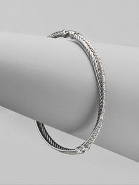 From the Silver Ice Crossover Collection. A twisted cable crisscrosses a diamond band in this graceful bangle of sterling silver and 14k white gold. Diamonds, 0.49 tcw Sterling silver and 14k white gold Diameter, about 2¼ Made in USA