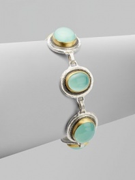 From the Gauntlet Collection. Smooth linked ovals of pastel aqua chalcedony, elegantly framed in granulated sterling silver and hammered 24k gold.Aqua chalcedonySterling silver and 24k yellow goldLength, about 7½Imported