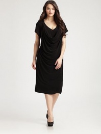 A refreshing take on the classic LBD, this knit design features an ingenious combination of a v-neck and cowlneck and it features body-flattering draped details for an unforgettable look. Cowlneck detail at v-necklineShort sleevesDraped details on frontAbout 31 from natural waistRayonHand washImported