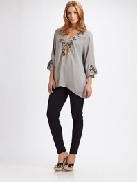 An easy-going design with gorgeous embroidery and a flattering, relaxed fit.Embroidered v-neckThree-quarter sleevesPull-on styleCurved hemAbout 31 from shoulder to hemRayonMachine washImported