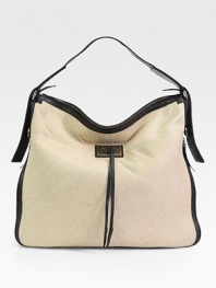 Woven hemp gives a boho feel to this roomy top-handle carryall finished with rich leather trim.Top handle, 3¾ dropTop zip closureExpandable zip gussetsOne inside zip pocketTwo inside open pocketsSating lining16½W X 15¾H X 4¾DMade in Italy