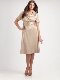 An elegant stretch satin design inspired by the classic trench coat. Collar neckShort sleevesButton-detail cuffsSelf-tie at waistAbout 25 from natural waist55% polyester/42% rayon/3% spandexDry cleanMade in USA of imported fabric