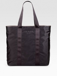 Handsome tote with logo detail. Single zip and snap closures 15¾W X 15¾H 6D Made in Italy 