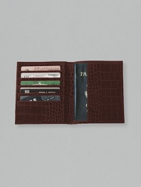 Crafted of crocodile-embossed Italian calfskin, it includes 5 credit card slots and passport compartment. 4½ X 5½ Made in USA
