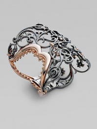 From the Les Dents De La Mere Collection. A rose gold plated shark jaw is hidden within an ornate filigree design of blackened sterling silver.Rose gold plated sterling silver Black rhodium plated sterling silver Diameter, about 2½ Imported