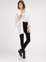 Inspired by the traditional kimono, this elegant topper is slightly oversized with wide bell sleeves and a stylish open front.Dropped shouldersWide kimono sleevesOpen frontHip patch pocketsSilk liningAbout 31 from shoulder to hemRayonMachine washImported