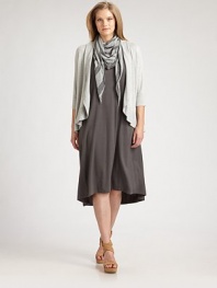 A unique oval silhouette lends a flattering, feminine drape to this soft knit style.Open front with shawl collarThree-quarter sleevesAsymmetrical hemlineRib-knit cuffs and edgesAbout 25 from shoulder to hem90% viscose/7% nylon/3% spandexDry cleanImported of Italian fabric