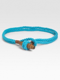 Accented with leather, this double-strand rope style offers a classic nautical look. Wooden toggle closureAbout 1 wideCottonDry cleanImported