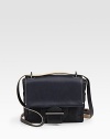 A petite flap-front silhouette pairs burnished glovetan, glazed bridle and vachetta leathers with a chic denim body.Adjustable crossbody strap, 24-26 dropSnap flap closureOne outside open pocketOne inside zip pocketOne inside open pocketFully lined7W X 6H X 2DImported
