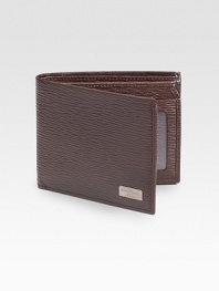Stamped calfskin wallet with five credit card slots, two currency departments and one ID window. 4½W X 3½H Made in Italy