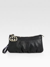Wristlet with interlocking G charm in guccissima leather with leather trim and nickel hardware.Wristlet strap, 4 drop Zip-top closure Fully lined 8¾W X 4½H X ½D Made in Italy