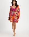 A bold floral print covers this draped design of silky-smooth fabric, creating a beautiful layering piece. Long kimono sleevesSelf-tie waist with belt loopsAbout 35 from shoulder to hemPolyesterMachine washImported