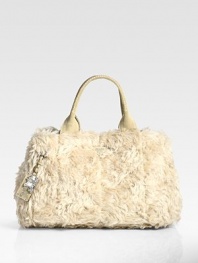 Soft faux fur defines this east-to-west silhouette, finished with a detachable heritage tag.Double top handles, 6½ drop Top snap closure Two inside zip pockets One inside open pocket Signature jacquard lining 18W X 10H X 10D Made in Italy