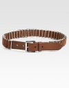A rich leather strap weaves in and out through polished metal buckles in this striking design.Leather strap and keeperPolished silvertone bucklesWidth, about 1Imported
