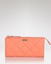 Uptown girls will love kate spade new york's quilted leather wallet. In luxe quilted leather with ample currency space, it's proof practical accessories can exude polish.