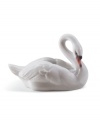 The epitome of elegance, the Lladro swan figurine captures all the serenity and grace of nature's ugly duckling in glazed porcelain.