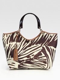 Add a touch of the wild to your favorite carryall, crafted from chic zebra-print canvas and rich leather trim.Double top handles, 7½ dropTop snap closureOne inside zip pocketTwo inside open pocketsFully lined15W X 8½H X 6DMade in Italy