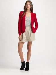 The tailored silk blazer, cropped and fitted with a single-button closureFoldover lapelsDefined shouldersWelt pocketsContour hem shorter in backAbout 24½ from shoulder to hemSilkDry cleanImported