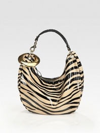 Bold zebra stripes highlight this slouchy silhouette of lustrous patent leather.Top handle, 7½ dropTop zip closureOne inside zip pocketOne inside open pocketSuede lining14W X 10H X 4½DMade in Italy