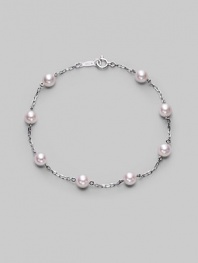 From the Akoya Collection. A delicate chain, sprinkled with lustrous white cultured Akoya pearls. 5mm white, round cultured pearls Quality: A+ 18k white gold Length, about 7 Spring ring clasp Imported