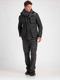 Smart design defines the performance-driven Orion jacket, crafted from sleek, water-repellent oxford with gunmetal hardware and a stowable hood for modern versatility.Mock neck collarZip front with snap storm flapShoulder epaulettesFront, chest flap pocketsAbout 30 from shoulder to hemFully linedNylonMachine washImported