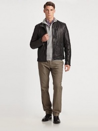 Short and trim, this variation on motocross styling in buttery lambskin offers lots of zippers.Band collar with snap close Front zipper Single zip chest pocket Two front zip pockets Long sleeves with zippers at cuffs Back yoke and seaming Fully lined Lambskin leather Dry clean by leather professional Imported