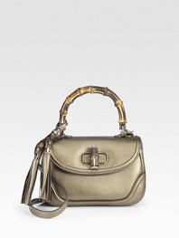 Metallic pebble-grain leather, finished with leather tassels, bamboo details and light goldtone hardware.Top handle, 5 drop Removable leather shoulder strap, 17¾ Flap with turnlock closure Inside mirror with Gucci logo One inside zip pocket Two inside open pockets Fully lined 10½W X 6½H X 4D Made in Italy