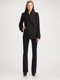 Double-breasted classic is impeccably tailored in exceptionally warm wool/cashmere.Wide notched lapel Button front Side buttoned pockets Buttoned tabs on sleeves Back buttoned half-belt Back vent at hem About 34 from shoulder to hem 80% virgin wool/20% cashmere Dry clean Imported