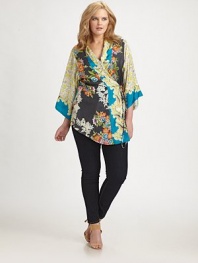 A fantastic duo of prints lends bohemian charm to sumptuous silk. The wrap-front design is especially flattering. V-neckThree-quarter sleevesWrap styleAbout 34 from shoulders to hemSilkDry cleanImported