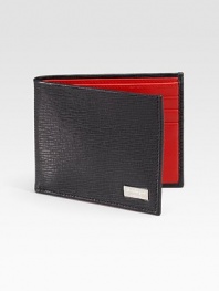 A slim-line design handsomely crafted in Italy from embossed calfskin leather.One bill compartmentSix card slots4¼ x 3½Made in Italy