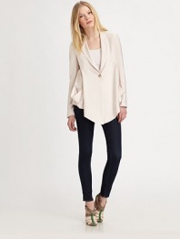 A lightweight blazer with an asymmetrical hem is a must-have casual cool spring look. Notched collarDropped shouldersLong sleeves with button cuffsSingle button front closureDual patch pocketsAsymmetrical hemAbout 20¾ from shoulder to hem90% rayon/10% nylonDry cleanImportedModel shown is 5'10 (177cm) wearing US size 4.