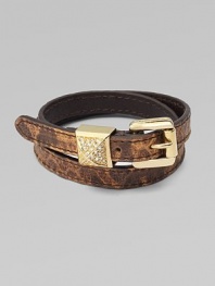Supple, snake-print leather in a chic, double-wrap design with a logo accented buckle and rhinestone detailed, pyramid keeper. Snake-print leatherBrass and zincGlass stonesLength, about 16Buckle closureImported 