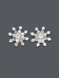 Blindingly beautiful. 14k white gold snowflake-shaped studs shimmer with round-cut diamond (1/4 ct. t.w.). Approximate diameter: 3/4 inch.