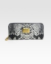 Luxe snake-print highlights this slim zip-around silhouette of rich PVC.Zip-around closureCenter zip compartmentTwo inside open pocketsEight credit card slotsFully lined7¾W X 3/4H X 3¾DImported