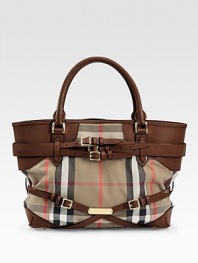 Iconic Burberry check makes a statement in this roomy leather-trimmed carryall, finished with goldtone hardware and buckled leather straps.Double top handles, 5 drop Protective metal feet Two inside zip pockets Cotton lining 14W X 11H X 6D Imported
