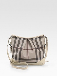 Chic Burberry check PVC, shaped by soft pleats in a slouchy carryall, finished with rich calfskin trim.Adjustable crossbody strap, 19-22½ dropTop zip closureOne inside zip pocketTwo inside open pocketsCotton lining12W X 10H X 1/2DImported