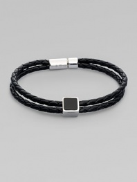 A double strand of braided Italian leather is offset by a sterling silver cube on one side and clasp on the other. Black leather bracelet features agate and sodalite inlay Brown leather bracelet features tiger's eye and ebony inlay Leather Sterling silver About 8¼ long Pop clasp Made in the United Kingdom 