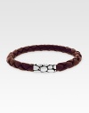 A sterling silver button clasp offers contrasting color and texture to finely braided leather. Length, about 8 Imported