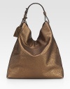 Shapely and simple, in metallic tumbled grain leather, this softly slouched hobo has ample room, like your favorite tote.Adjustable smooth leather top handle, 7 drop Open top One inside zip pocket Two inside open pockets Cotton lining 15W X 15H X 4½D Imported
