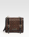 The structured satchel crafted from woven chevron stripes of sleek patent leather and contrast yarn, adorned with front buckled straps.Braided top handle, 11 dropFlap snap closureOne inside zip pocketOne inside open pocketLeather lining9W X 7½H X 2¾DImported