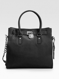 Beautifully tailored and versatile design of rich leather, finished with double top handles and a shoulder strap.Double top handles, 5 drop Chain and leather shoulder strap, 12 drop Magnetic snap closure Protective metal feet One inside zip pocket Four inside open pockets Fully lined 14W X 13H X 5½D Imported
