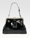 Lush patent leather in a gorgeous frame-top silhouette for lady-like chic.Adjustable shoulder strap, 9¾-11 dropTop clasp closureProtective metal feetOne inside zip pocketTwo inside open pocketsCotton lining15¼W X 10H X 3½DImported