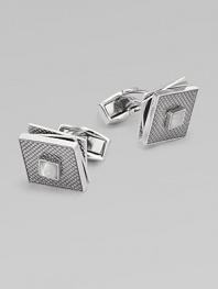High-polish rhodium-plated metal with a fixed square back, hatched texture and rotating tiers. T backingAbout ½ diam.Plated metalMade in the United Kingdom