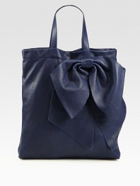 Sumptuous calfskin shaped by an oversized bow for a unique silhouette.Double top handles, 6½ dropTop snap closureInner zip pouchSuede lining13¼W X 15½H X 2DMade in Italy