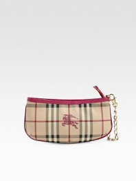 This compact silhouette with classy goldtone chain features classic checks on a long lasting PVC/cotton blend.Wristlet chain, 6 drop Top zip closure Nylon lining PVC/Cotton 9½W X 4½H X 1½D Made in Italy