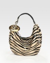 Bold zebra stripes highlight this slouchy silhouette of lustrous patent leather.Top handle, 7½ dropTop zip closureOne inside zip pocketOne inside open pocketSuede lining14W X 10H X 4½DMade in Italy